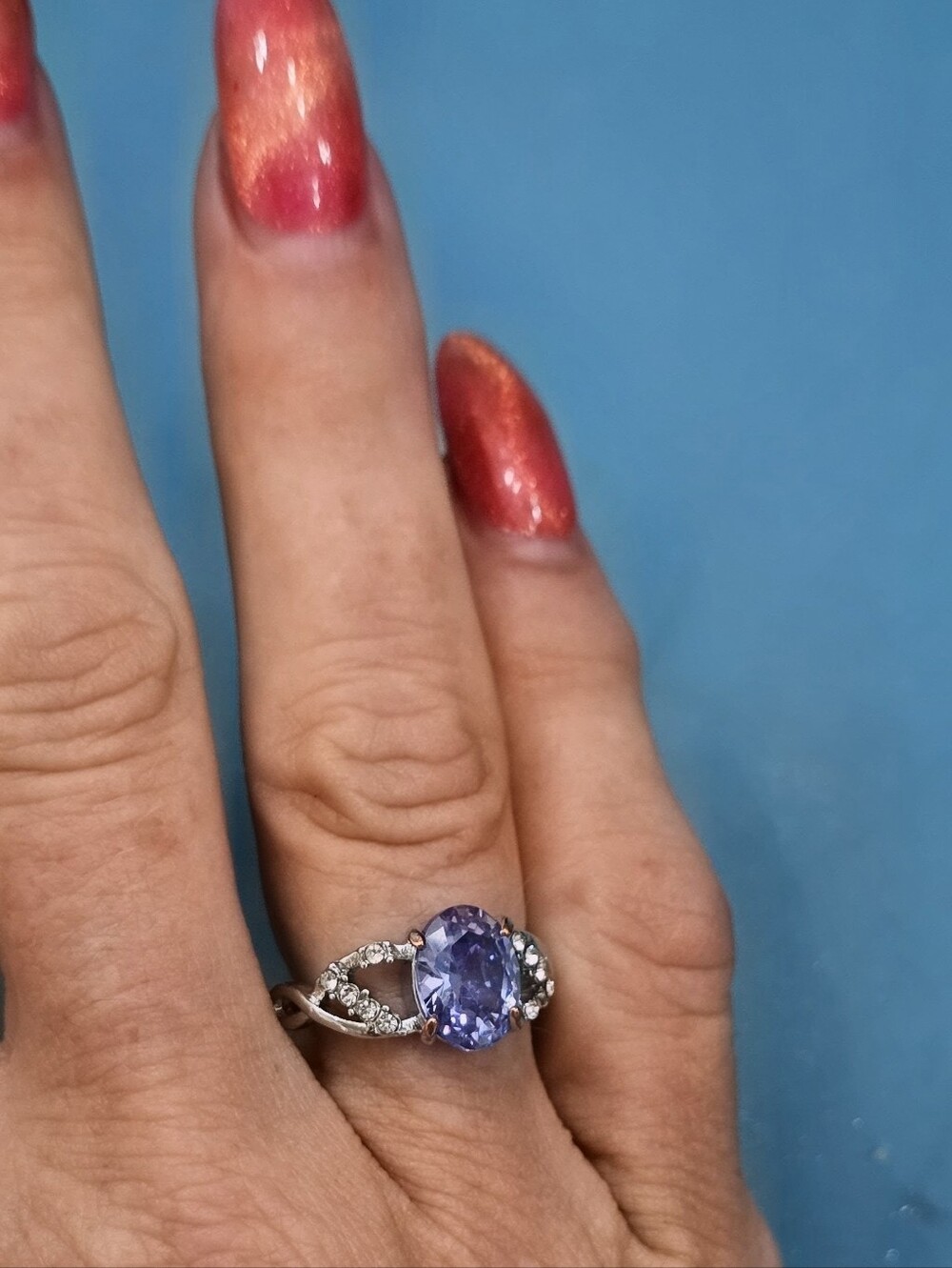 stunning cocktail gemstone ring featuring a central, oval-cut Stone Silver
